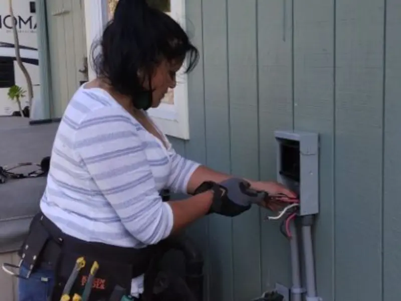 Licensed electrician wiring an exterior subpanel in Molalla