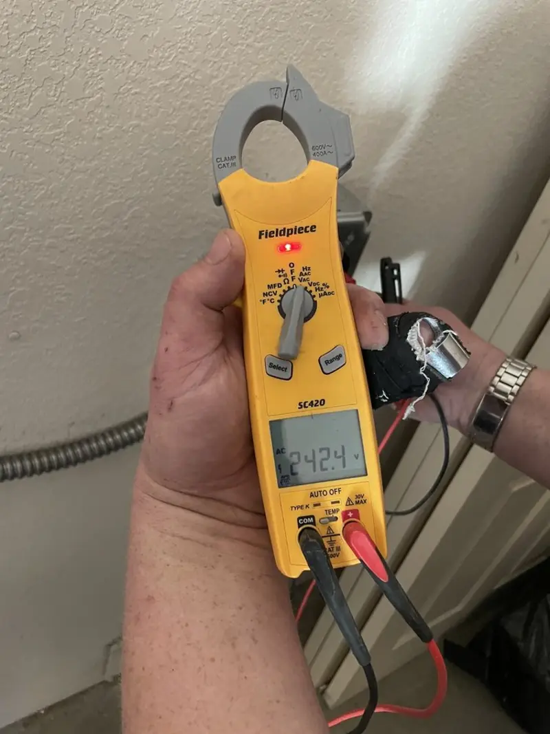 Voltage testing with clamp meter during Ceiling Fan Installation in Molalla